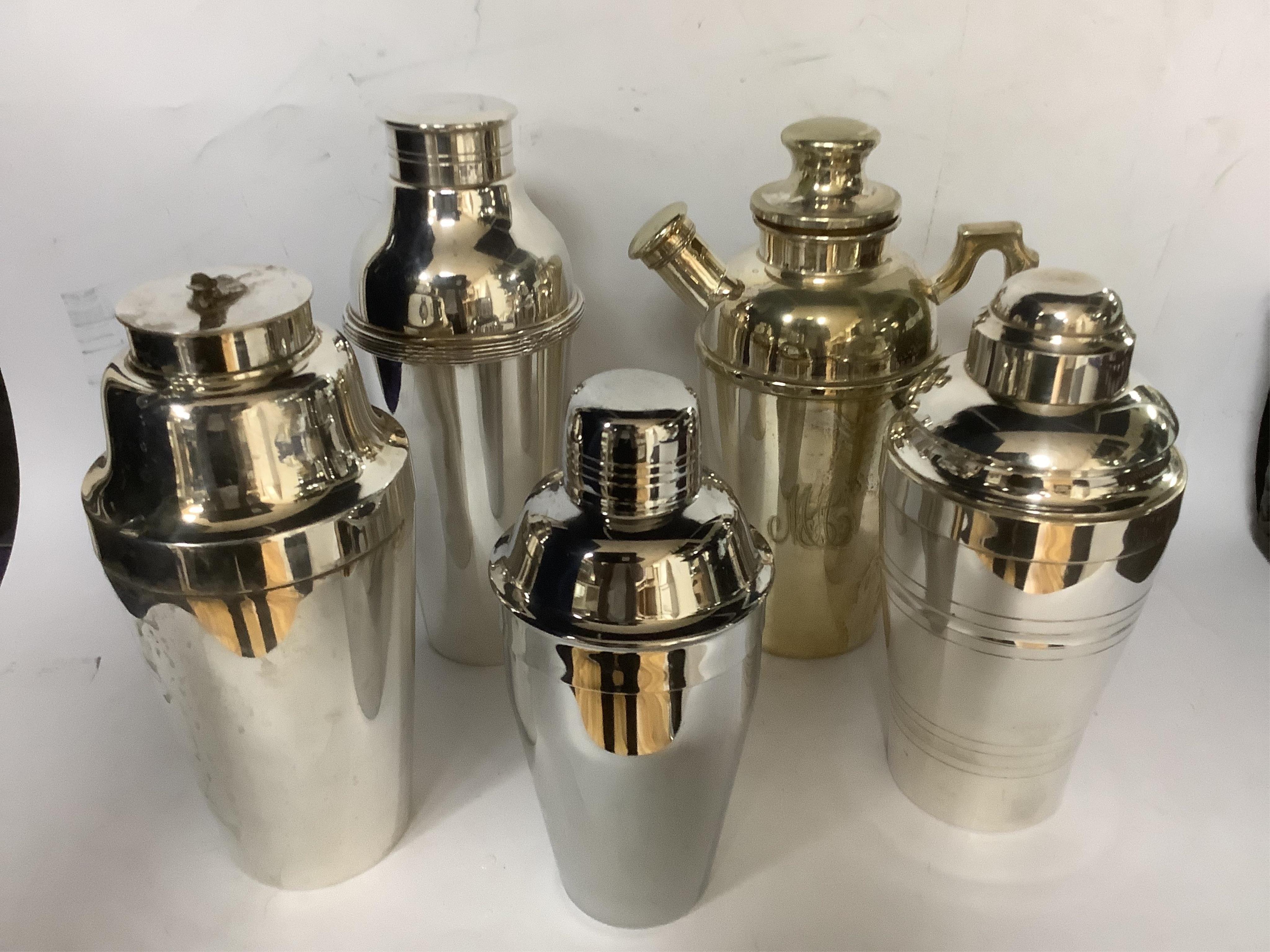 A group of five assorted silver plated or chrome cocktail shakers, including one by Walker & Hall, with damaged cockerel finial, tallest 15cm.